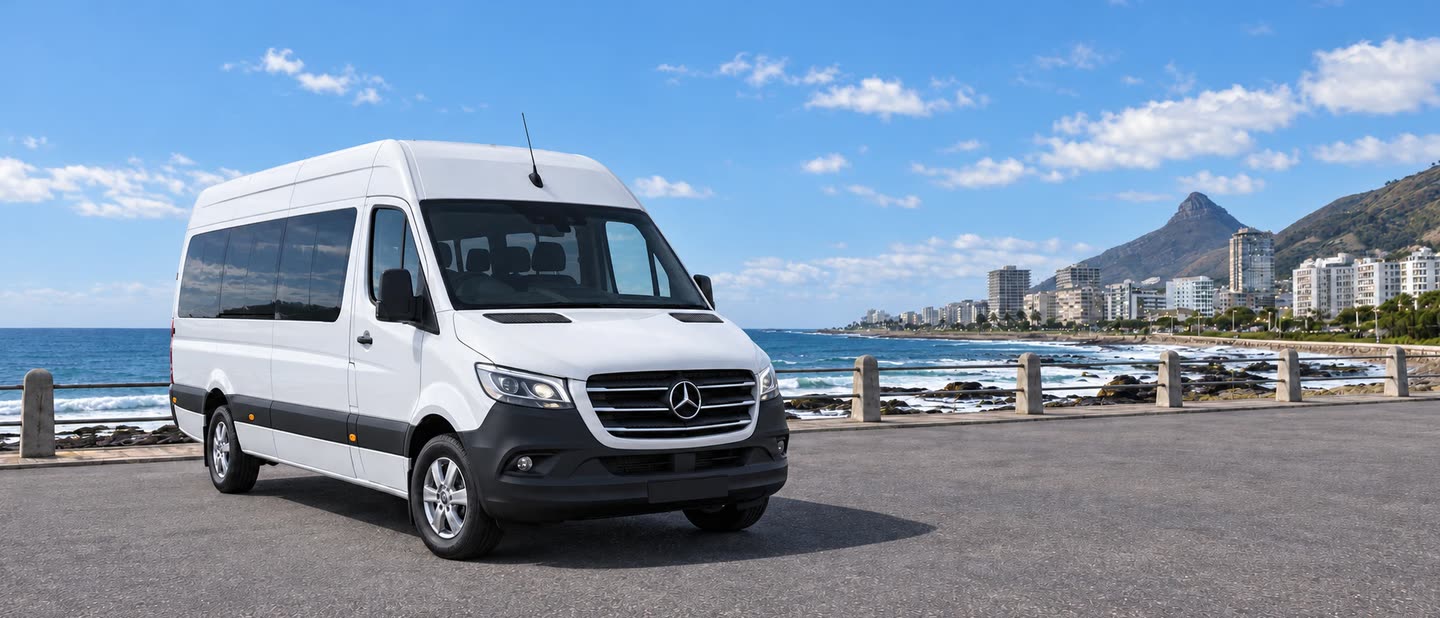 Белый пассажирский микроавтобус Mercedes-Benz Sprinter на набережной у моря